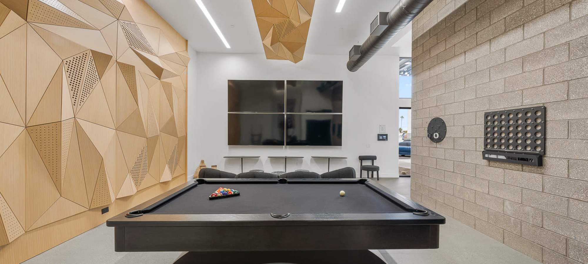 Game room inside spacious clubhouse at The M at Shadow Mountain in Phoenix, Arizona