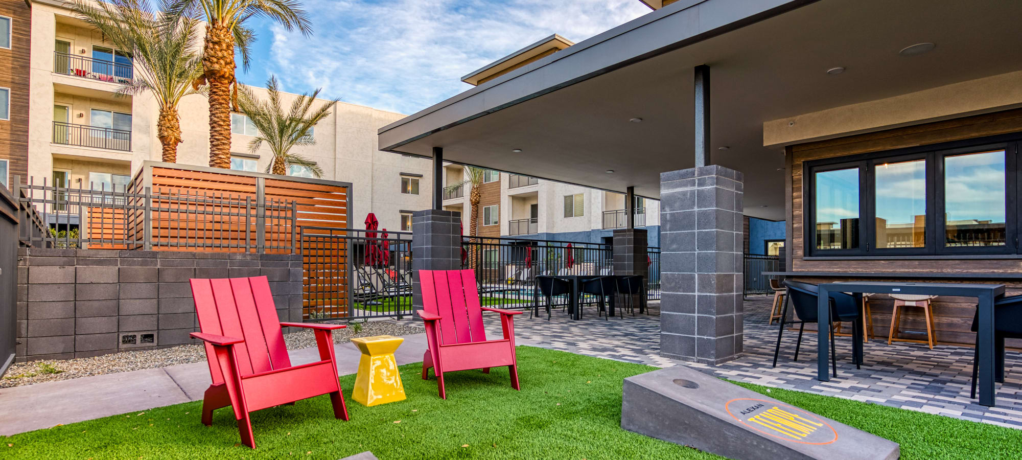 Lounge chair and corn hole at Alexan Tempe in Tempe, Arizona