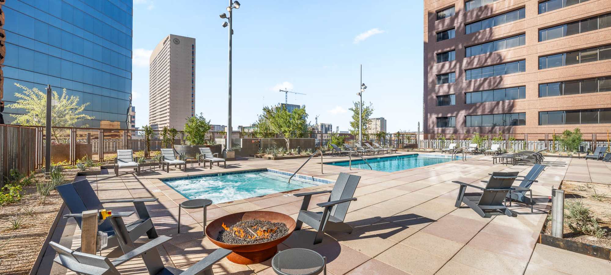 Resort style pool with firepits at PALMtower in Phoenix, Arizona