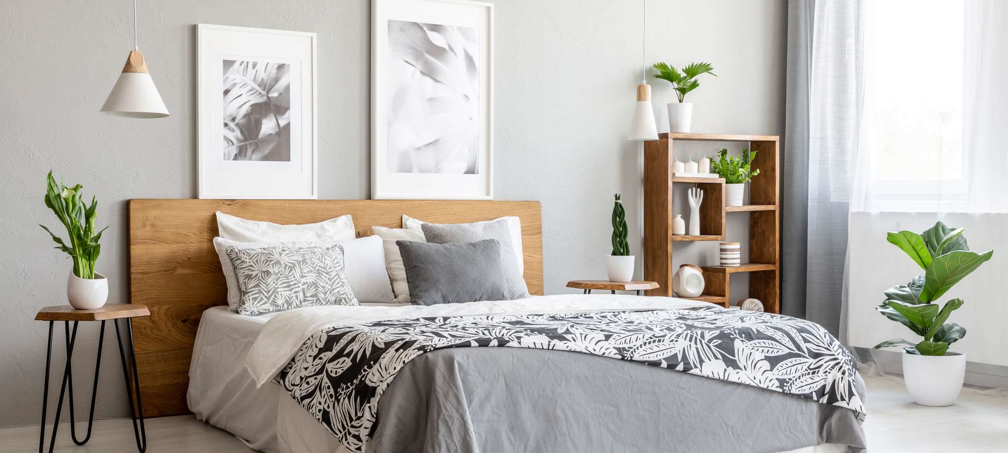 Stylish bedroom with plants and artwork at Legacy On Kiest in Dallas, Texas