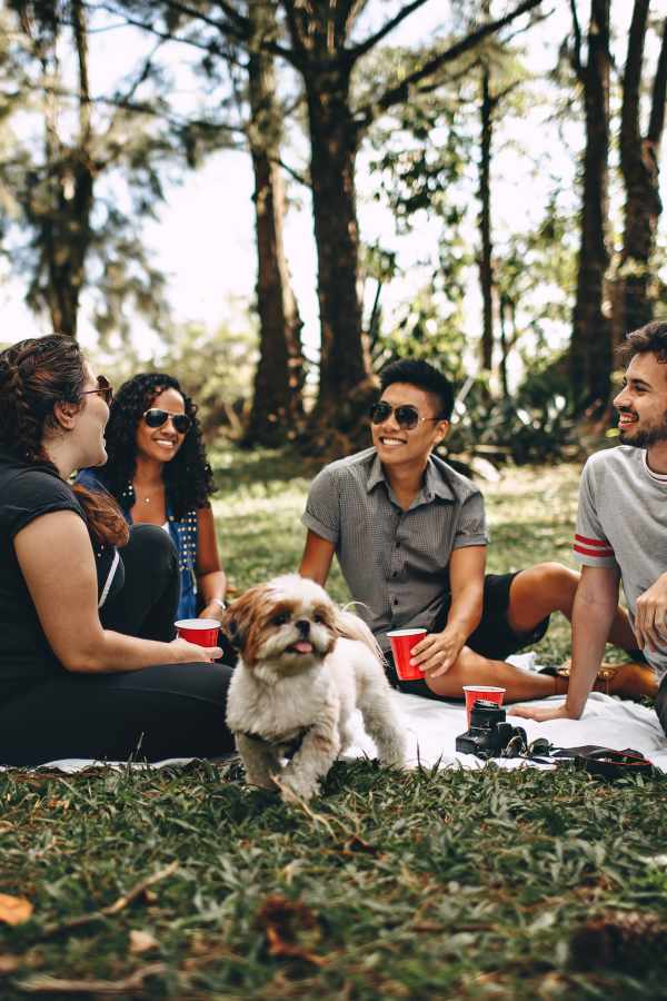 Residents enjoying their time in a park near The Abbey at Grande Oaks in San Antonio, Texas