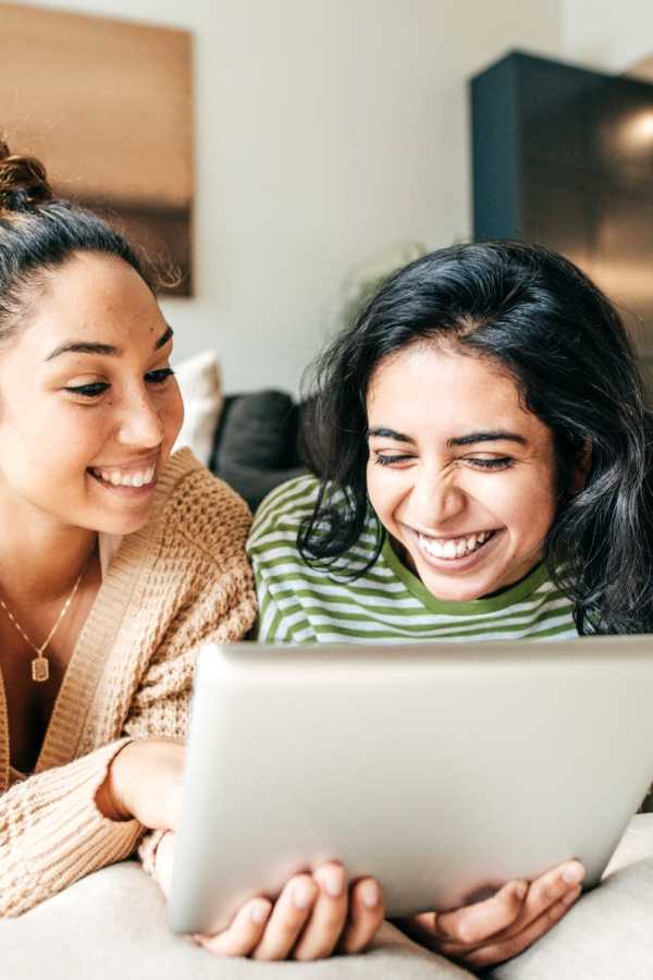 Two Girls Looking at iPad