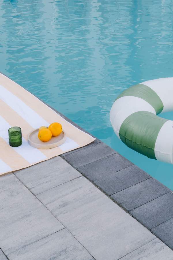 Lifestyle Photo taken of a pool float and pool towel