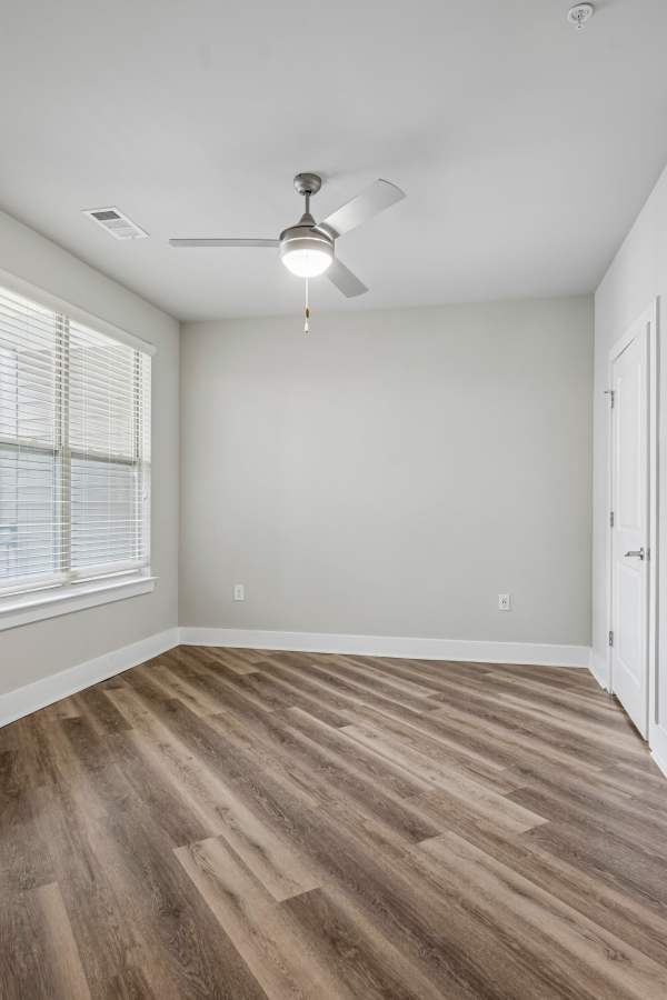 Kitchen with an island and stools at Centra At North Druid Hills in Atlanta, Georgia