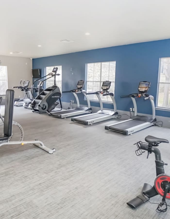 Fitness Center with plenty of cardiovascular equipment at The Leonard in Denton, Texas