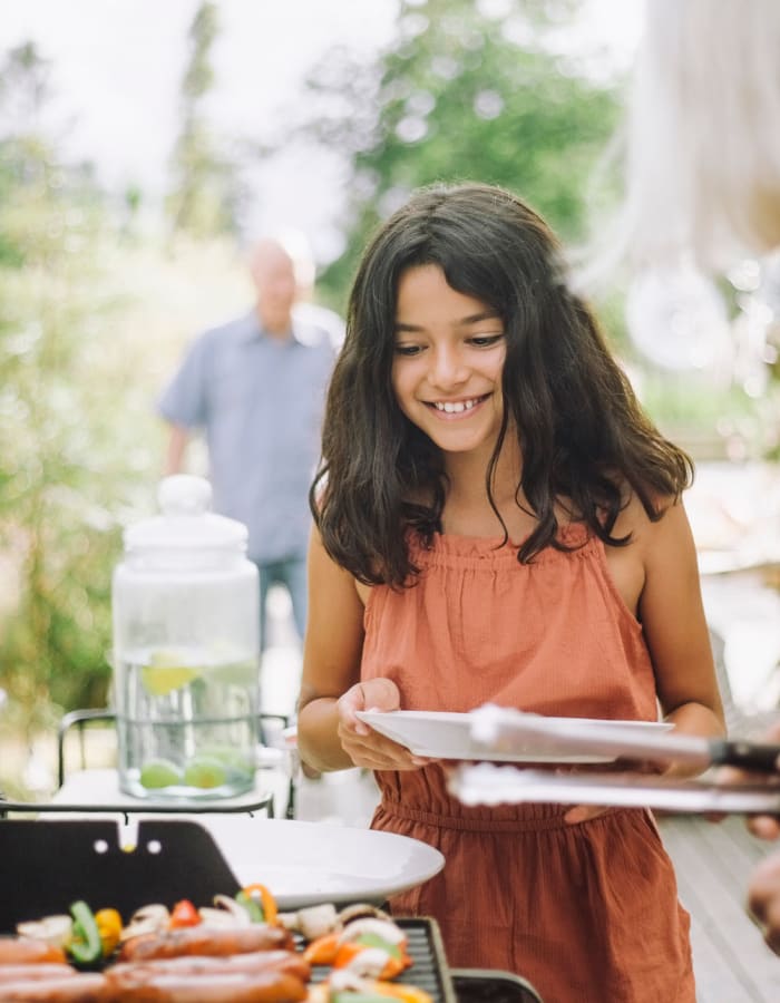 little girl by a barbeque at The Pointe in Fairfield, California