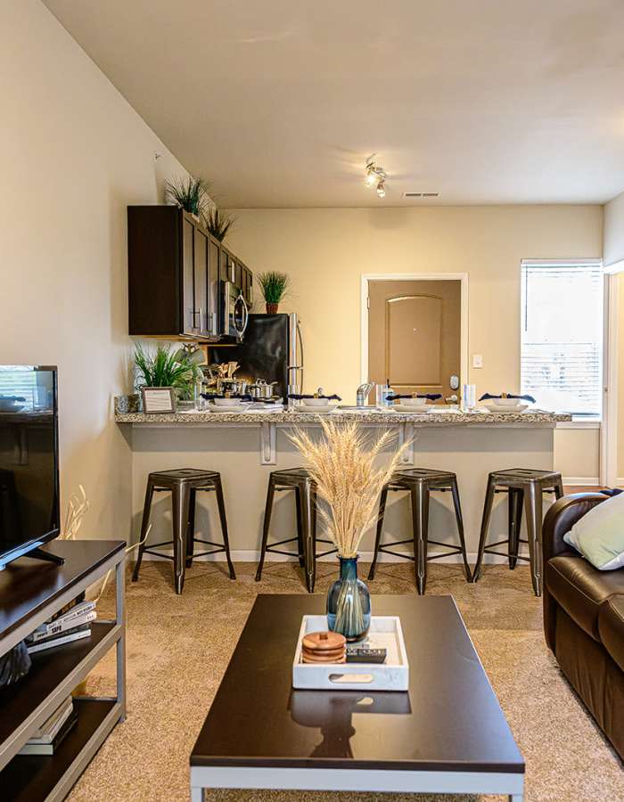 Model apartment with wood-style flooring at The Dillon in Bloomington, Indiana 
