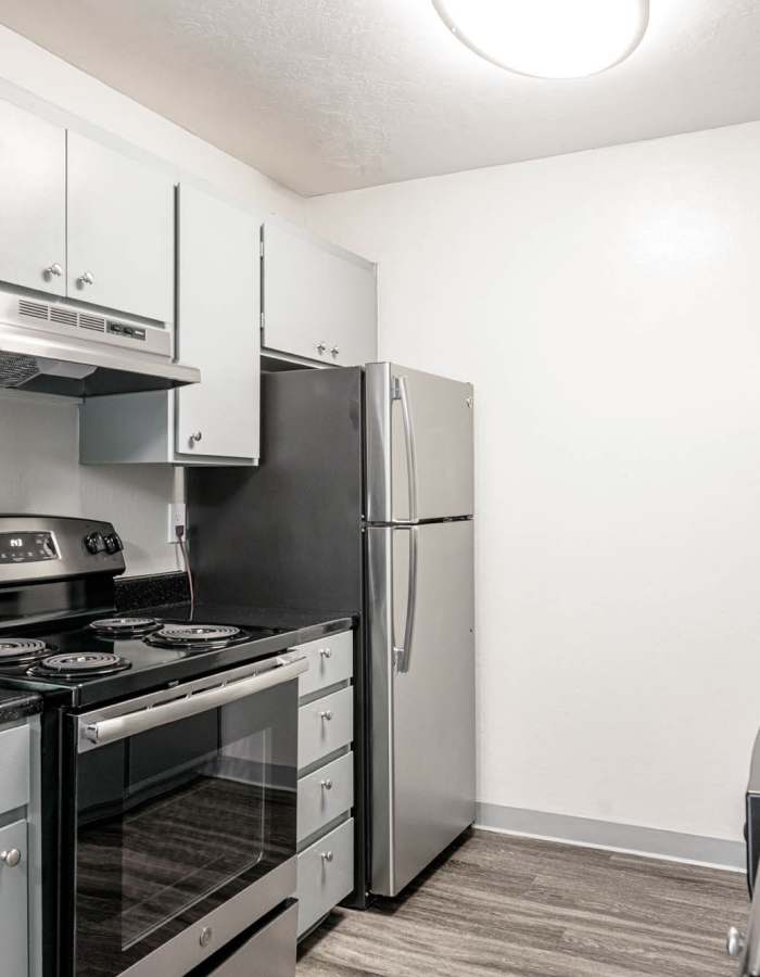 Stainless steel refrigerator and stove in kitchen at Hillside Garden in San Mateo in San Mateo, California