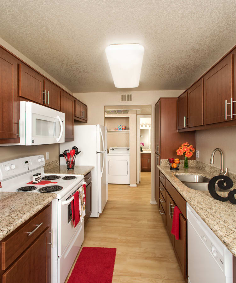 Cozy living room and kitchen/dining room with hardwood flooring at The Palisades at Paradise Valley Mall