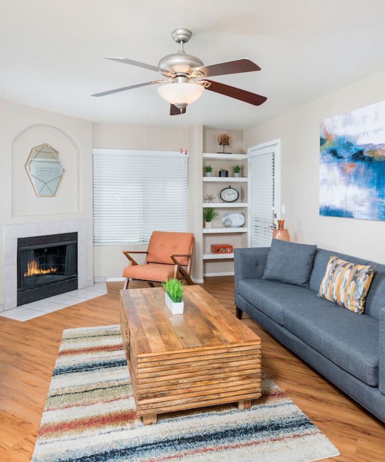 Model living room with hardwood flooring at San Marin at the Civic Center