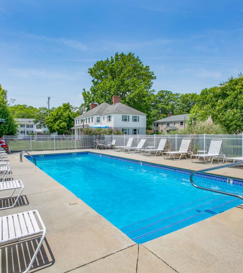 Swimming pool with seating at Sterling Oaks in Norfolk, Virginia