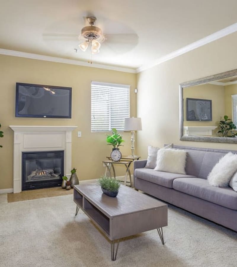 Modern living room with fire place at Castellino at Laguna West in Elk Grove, California