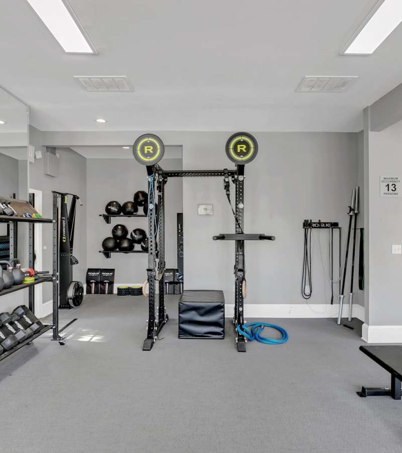 Well-equipped fitness center with multiple weights at Rosemont Windermere in Orlando, Florida