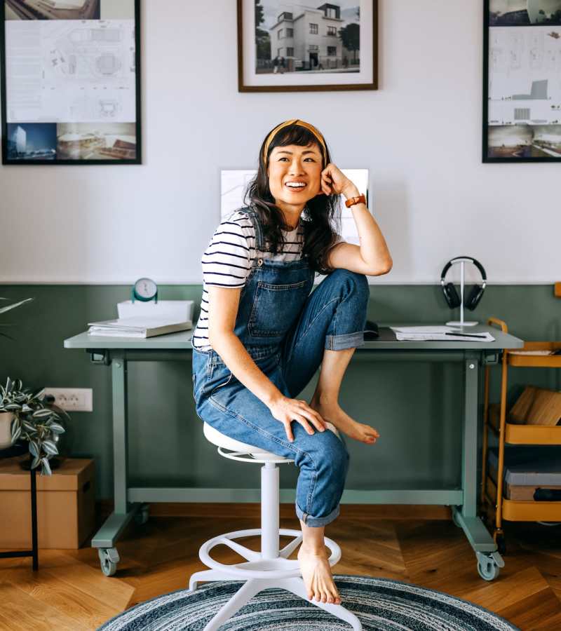 Resident sitting and smiling at The Indie Glendale Collection in Glendale, California