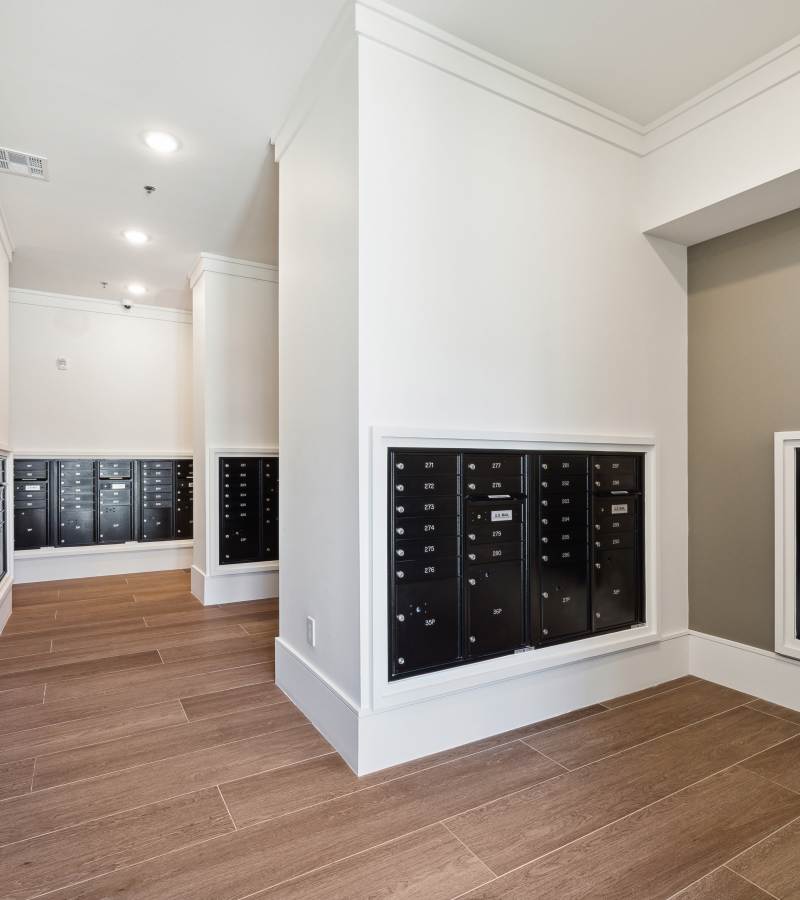 Mailboxes mounted on walls in hallway at Dakota at Deer Park in Deer Park, Texas