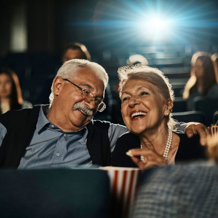 Two residents enjoying a movie at Gilfield Park in Charlotte, North Carolina
