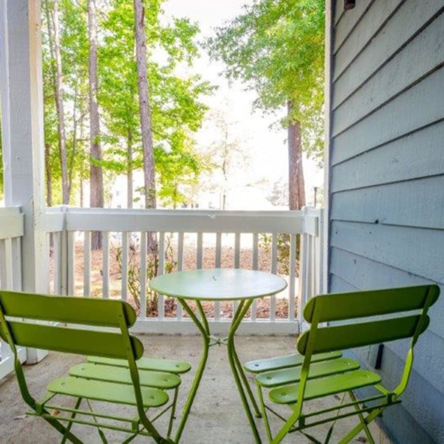 2 chairs on an apartment patio at Acasă Prosper Fairways in Columbia, South Carolina