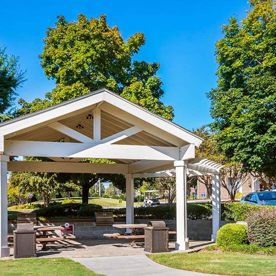 covered picnic tables at Acasă Orchard Park Apartments in Greenville, South Carolina