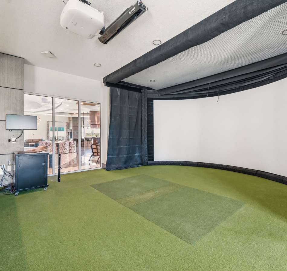 Game room with golf simulator at The Vivien in Vero Beach, Florida