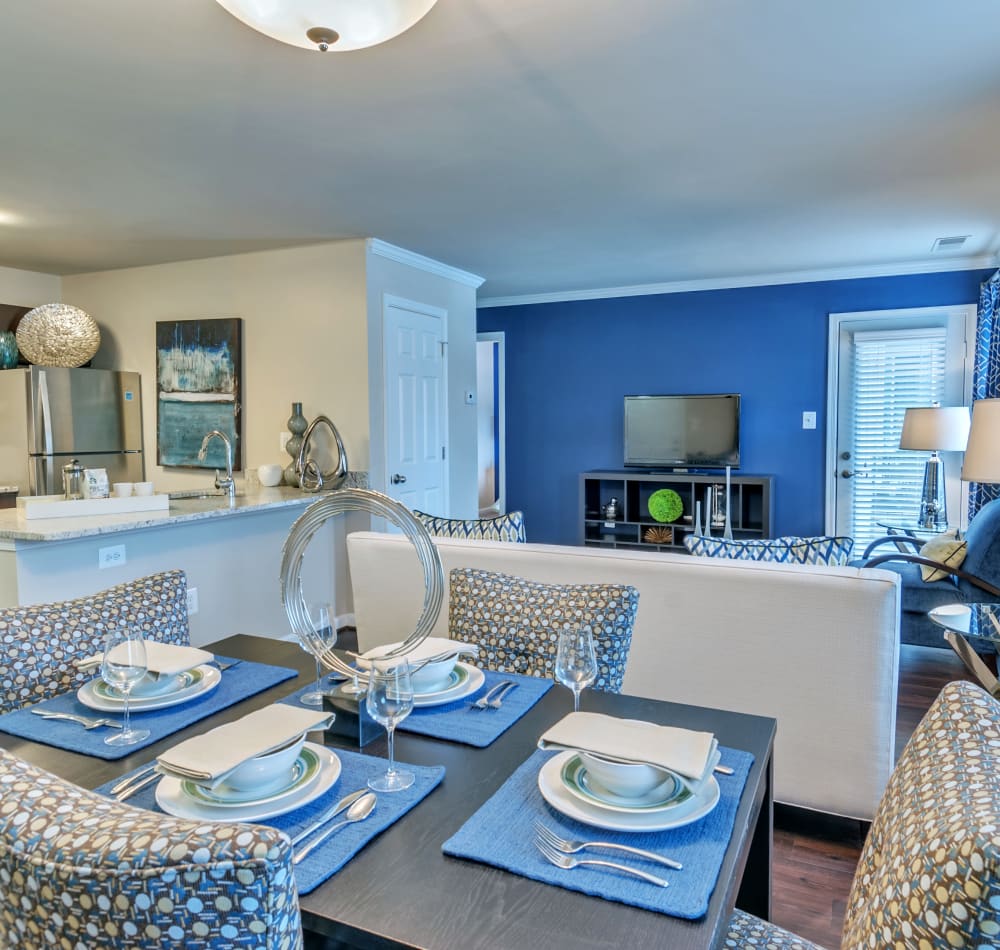 Modern well decorated bedroom with blue wall and accents in a model home at Knoll at Fair Oaks in Fairfax, Virginia