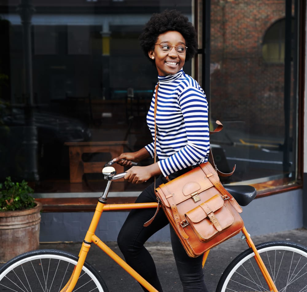 Resident enjoying bike commuting convenience at Anson in Burlingame, California