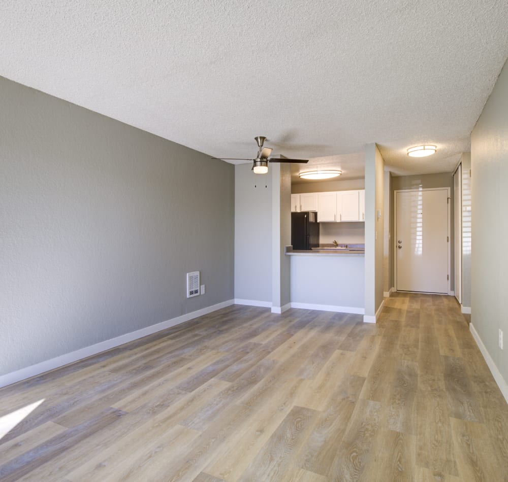 Resident stretching out on couch at Terra Apartment Homes in Federal Way, Washington