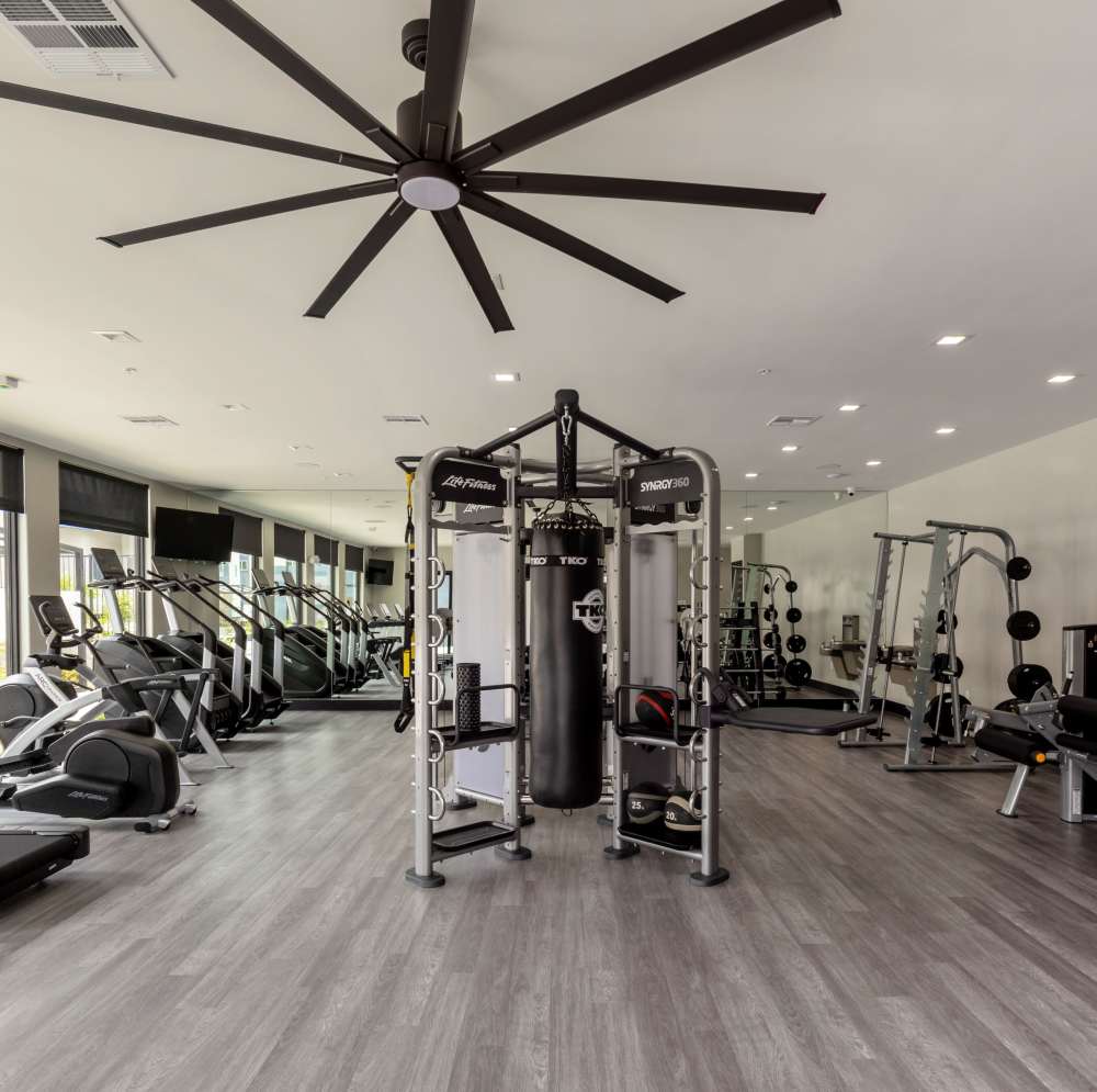 Fitness equipment and punching bag in gym at Continuum Apartments in Las Vegas, Nevada