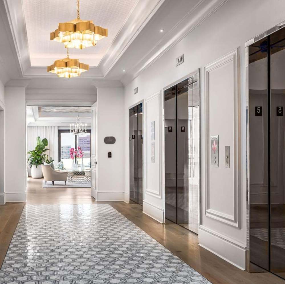 Elegant lobby with modern elevators at Novel Turtle Creek in Dallas, Texas