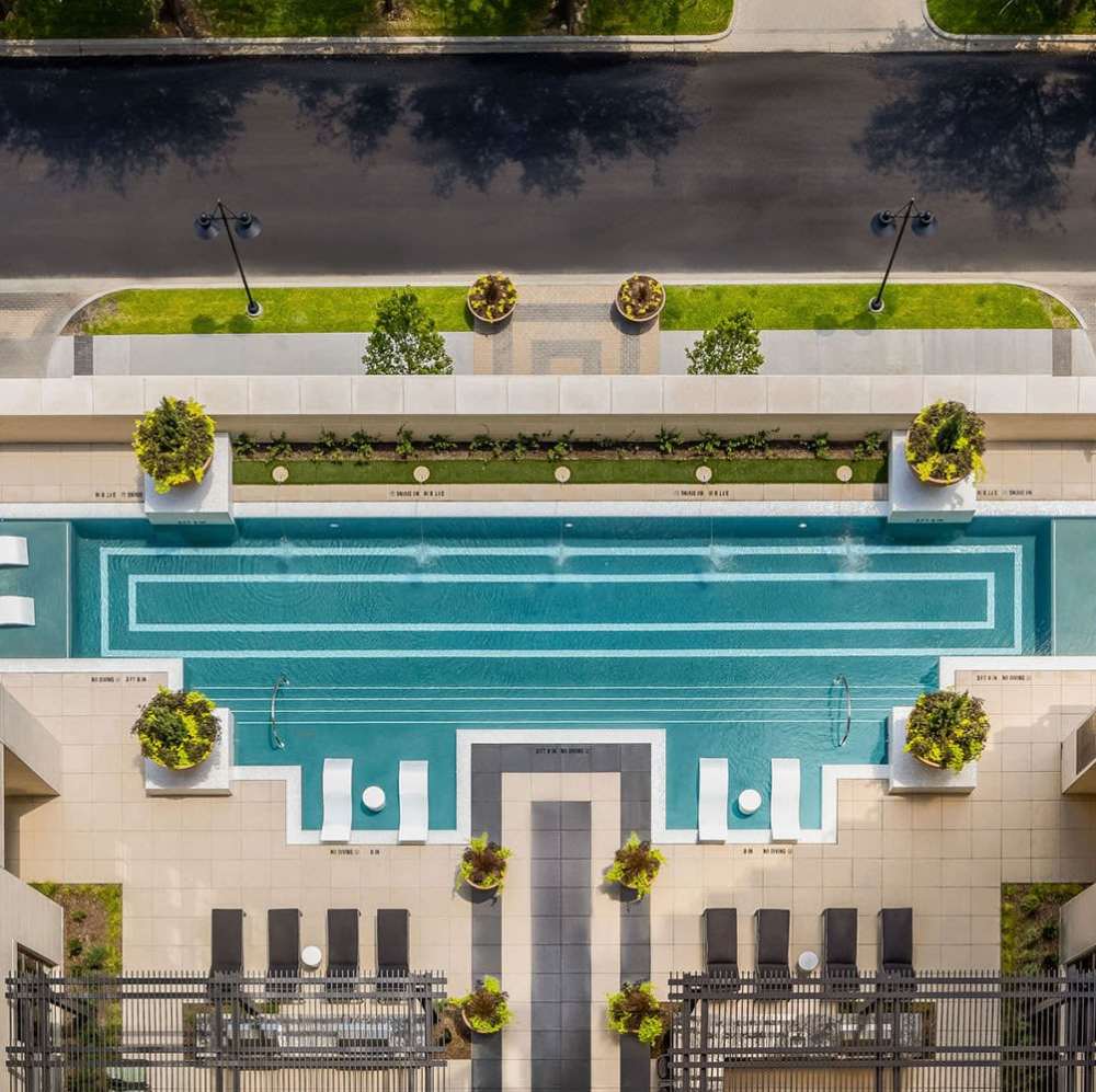 Aerial view of a sparkling resort-style pool at Novel Turtle Creek in Dallas, Texas