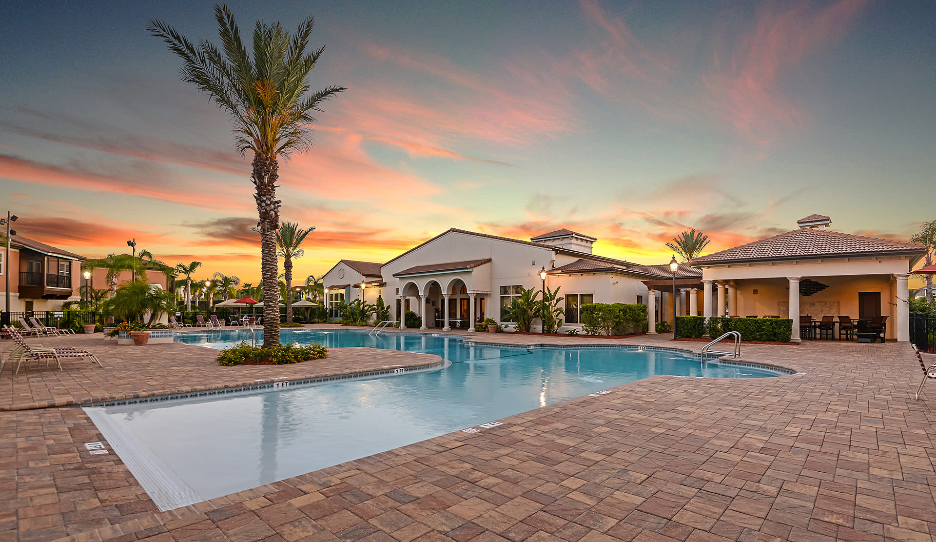 Swimming pool area at twilight at Hacienda Club in Jacksonville, Florida