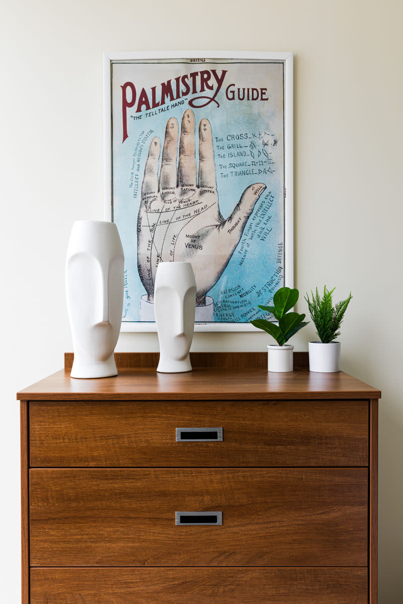 Sculptures and planters on an accent table in a student apartment at 20 Hawley in Binghamton, New York
