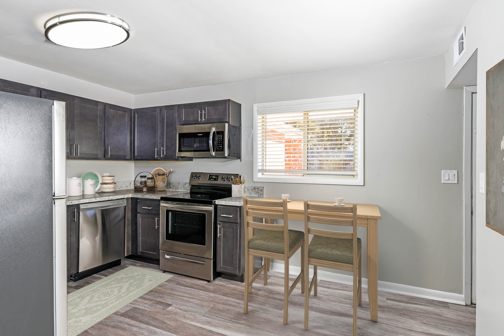 Model kitchen with dining room at Harborstone, Newport News, Virginia