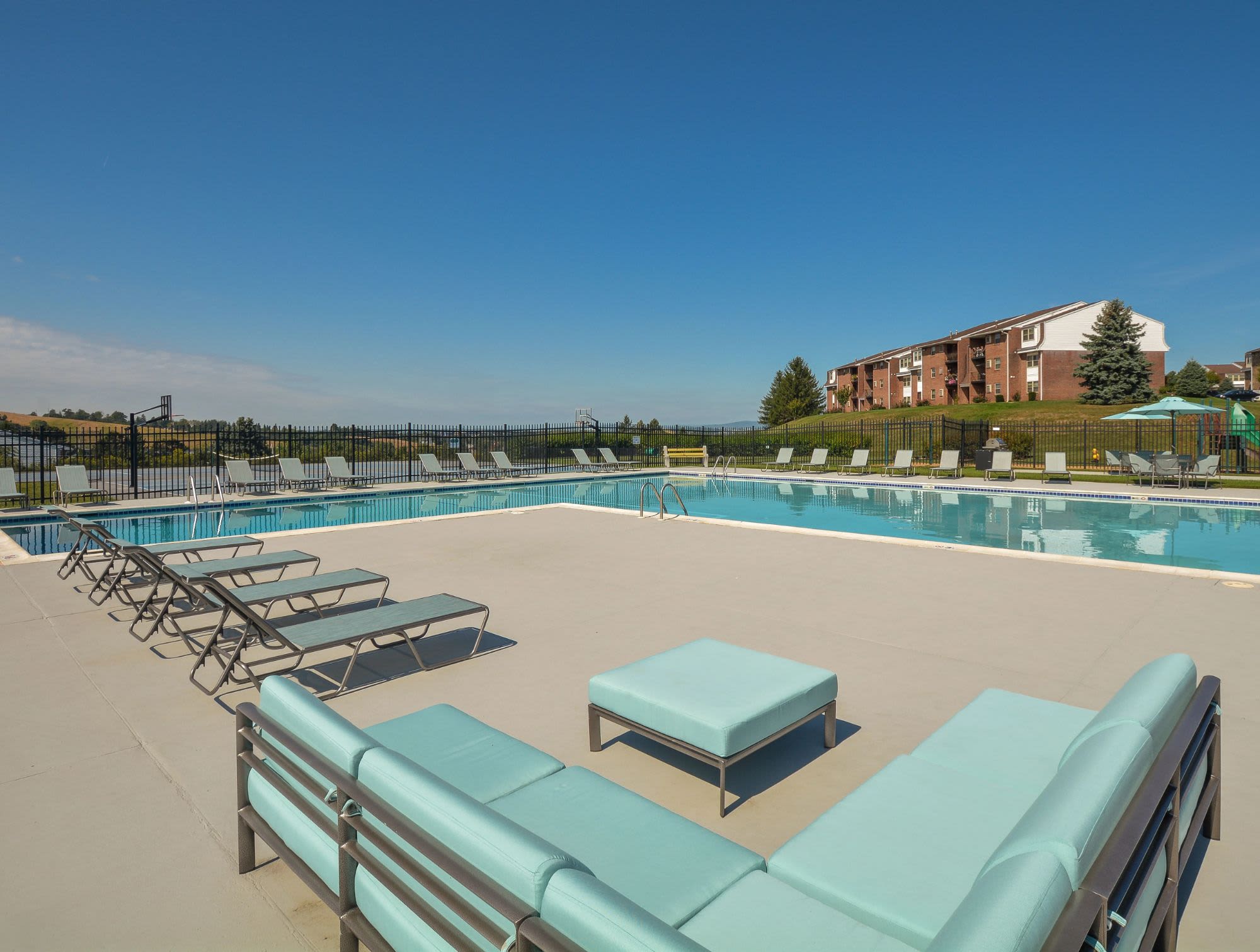 Outdoor swimming pool with chairs at Greenspring, York, Pennsylvania