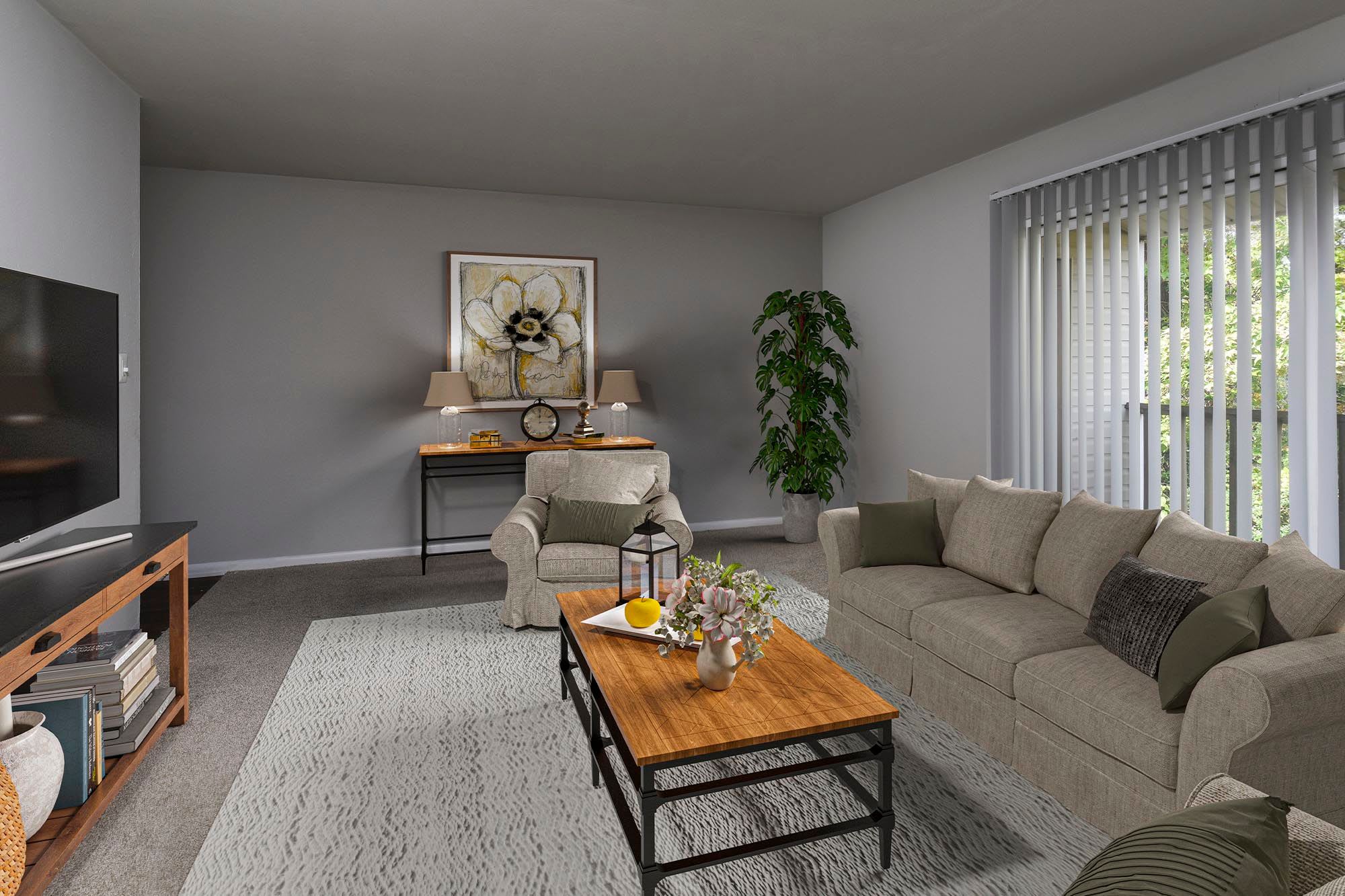 Model living room with TV at Chesapeake Pointe, Chesapeake, Virginia