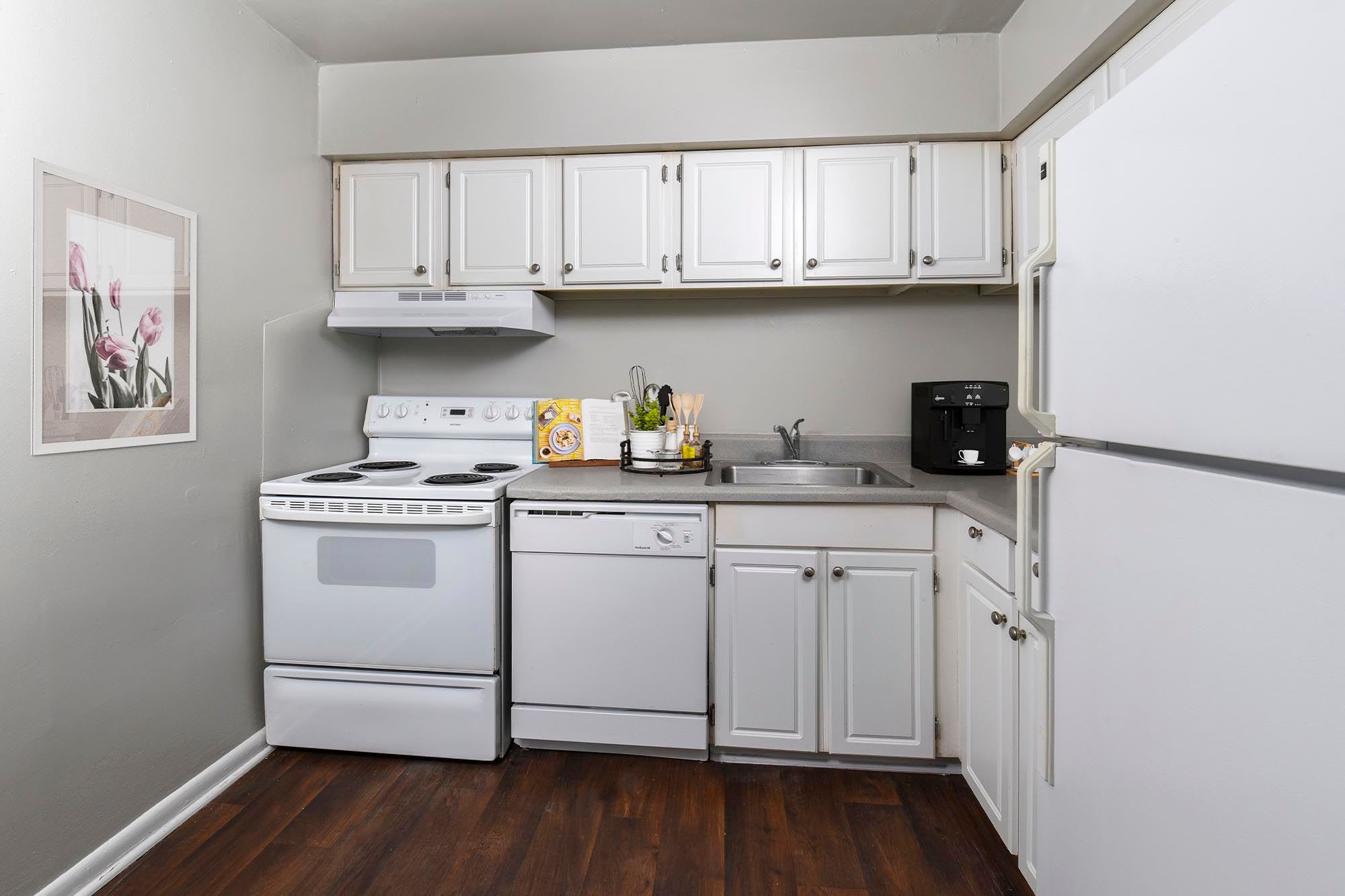 kitchen with white appliance by Chesapeake Pointe in Portsmouth, Virginia