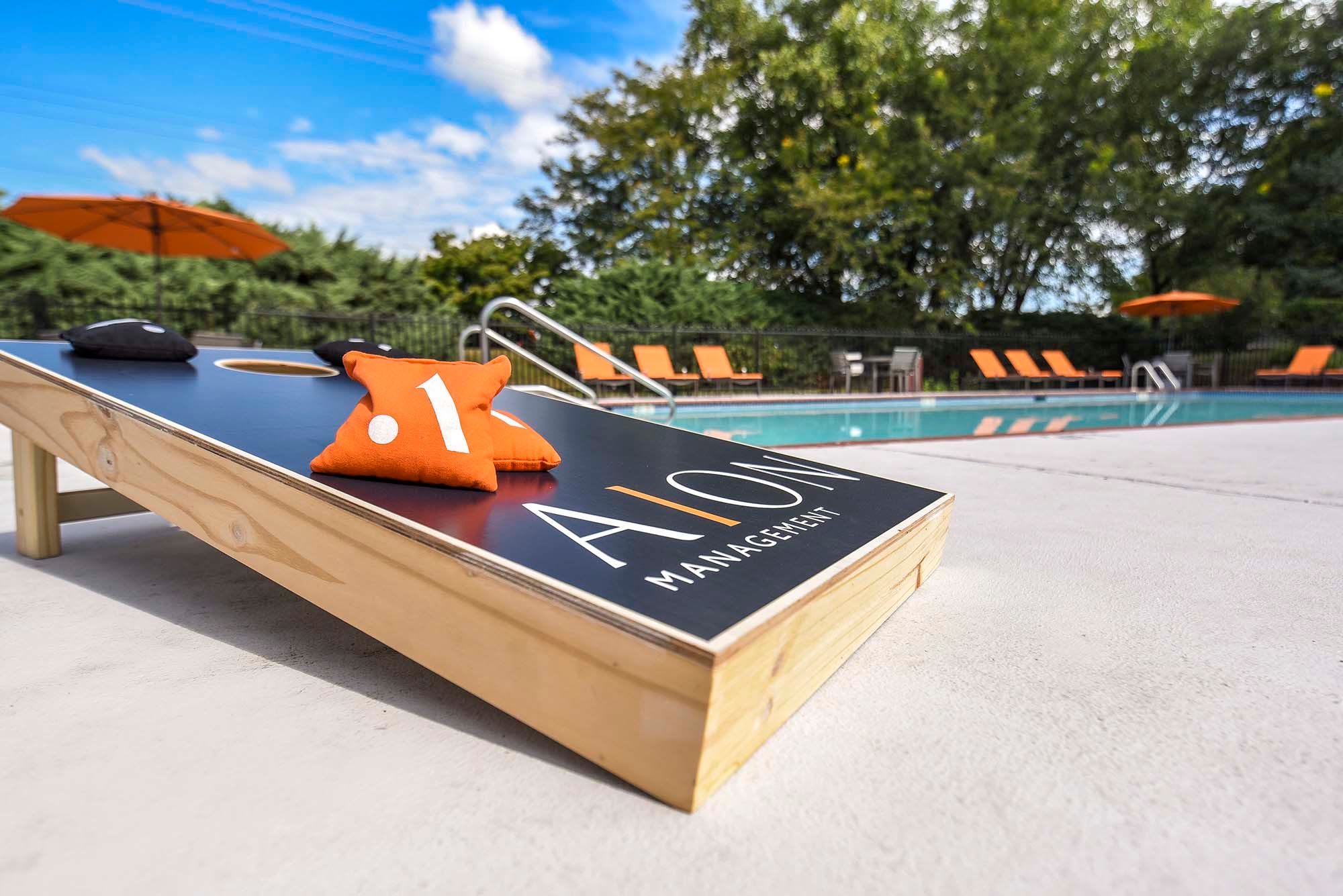 Outdoor cornhole game at Stonegate Apartments in Elkton, Maryland