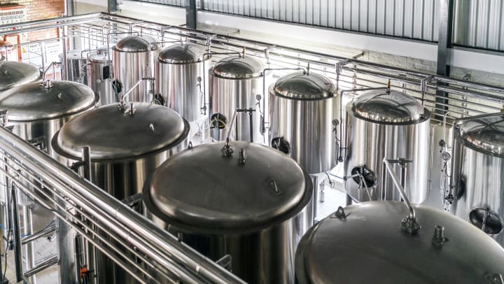 Overview of steel vats in a brewery