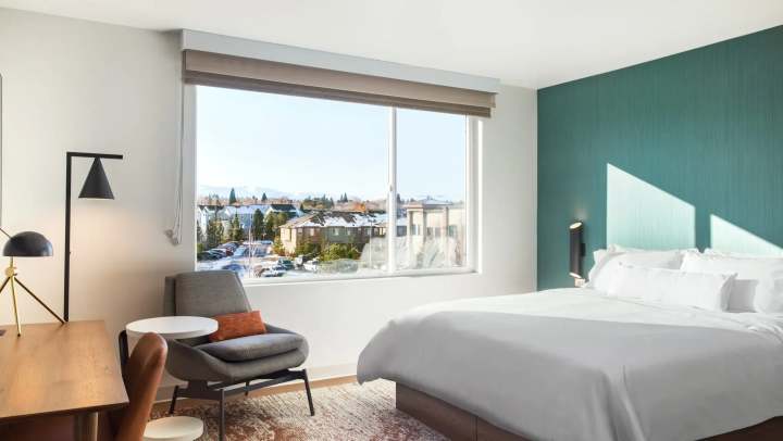 Bedroom in an apartment with large windows