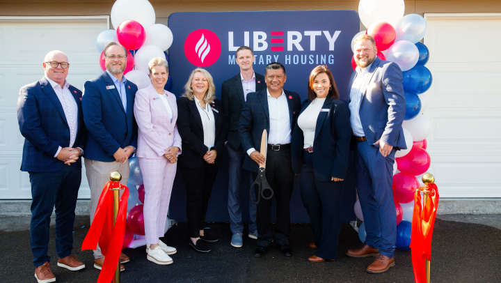 Liberty Military Housing team members cut the ribbon at the JBLM Training Academy