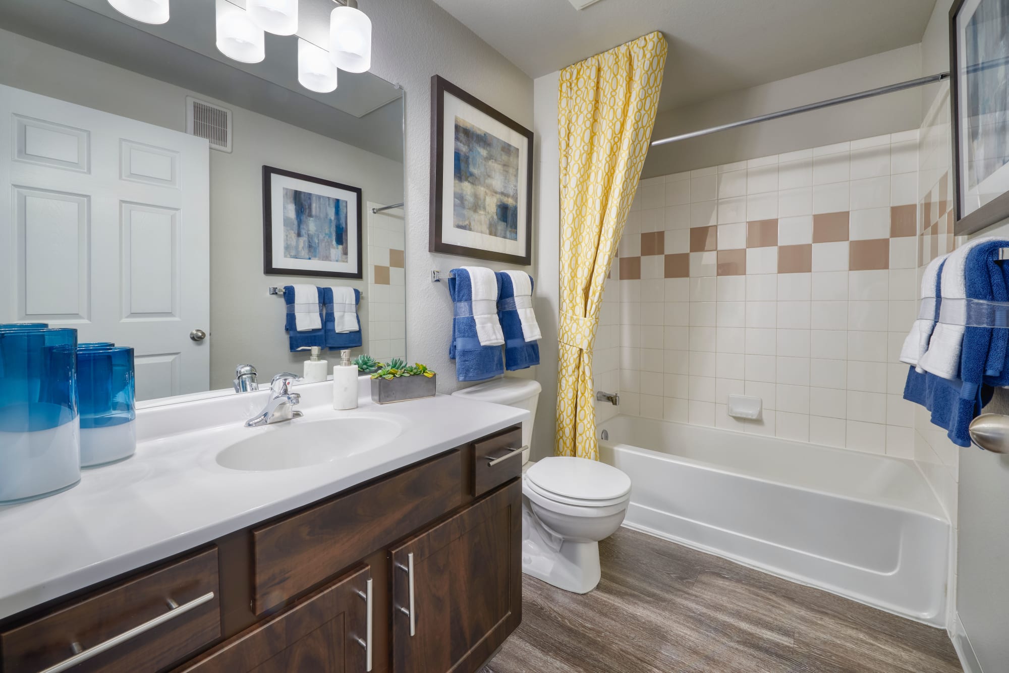Renovated bathroom with espresso cabinetry at Bear Valley Park in Denver, Colorado