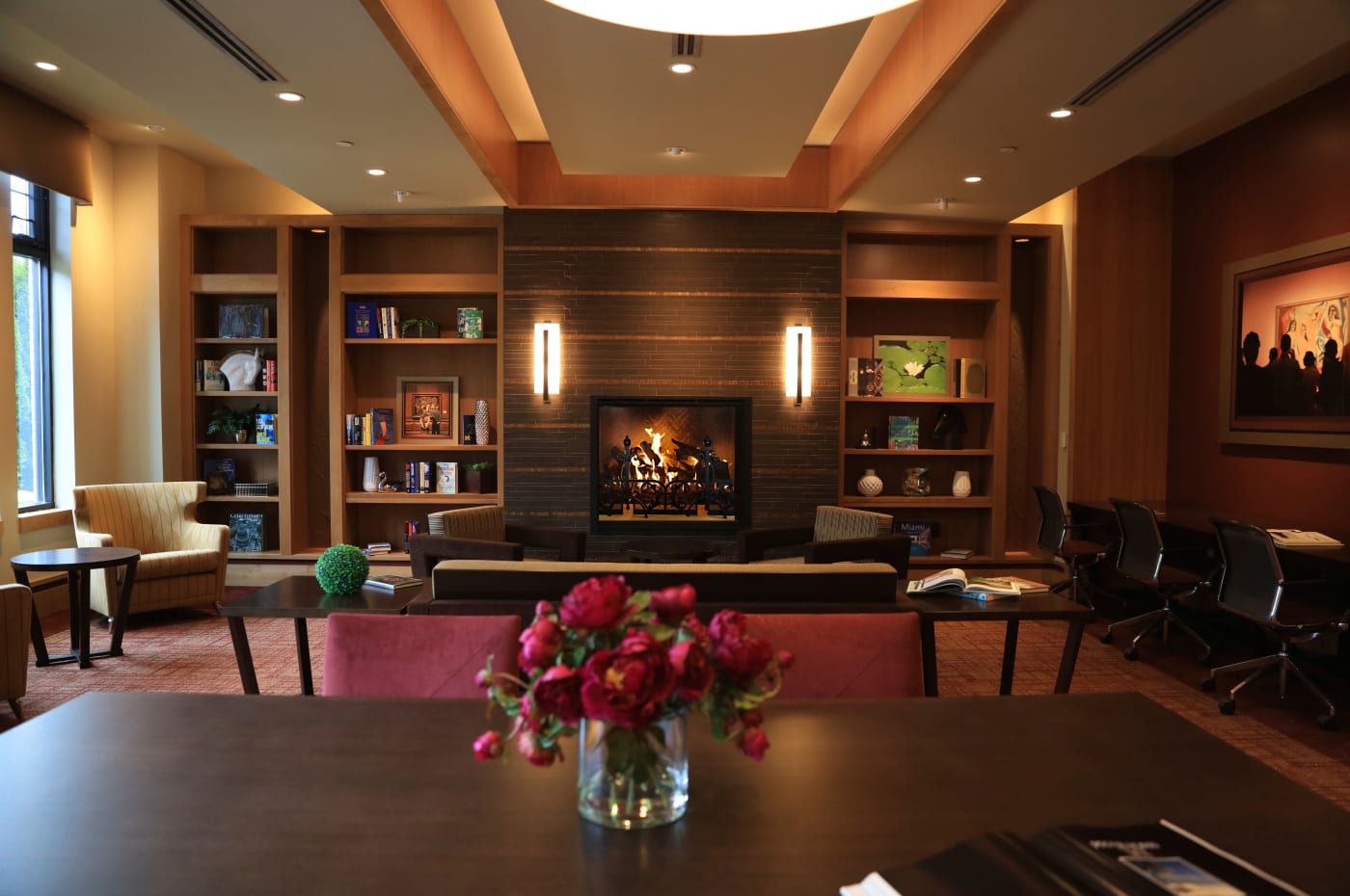 Cozy fireplace in the library at All Seasons Birmingham in Birmingham, Michigan