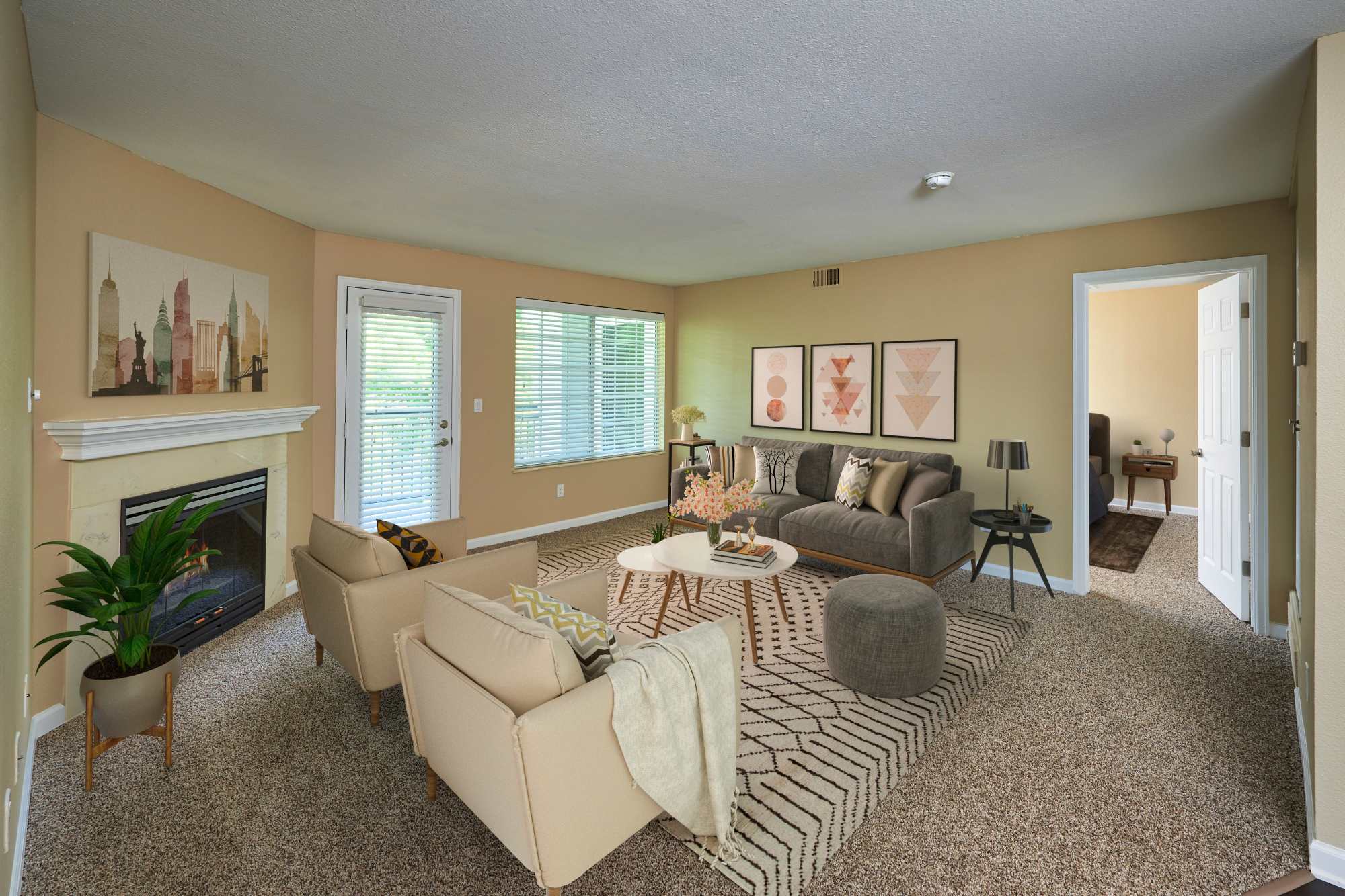 Living room with fireplace at Villas at Homestead Apartments in Englewood, Colorado