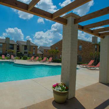 Cimarron Trails Apartments arbor near swimming pool