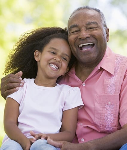 Grandfather with granddaughter at Chateau Retirement Communities