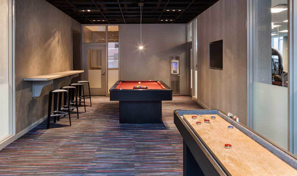 Eight O Five resident clubhouse featuring billiards and shuffle board