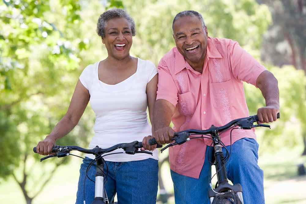 Couple On Bikes At Our Senior Apartments In Rochester