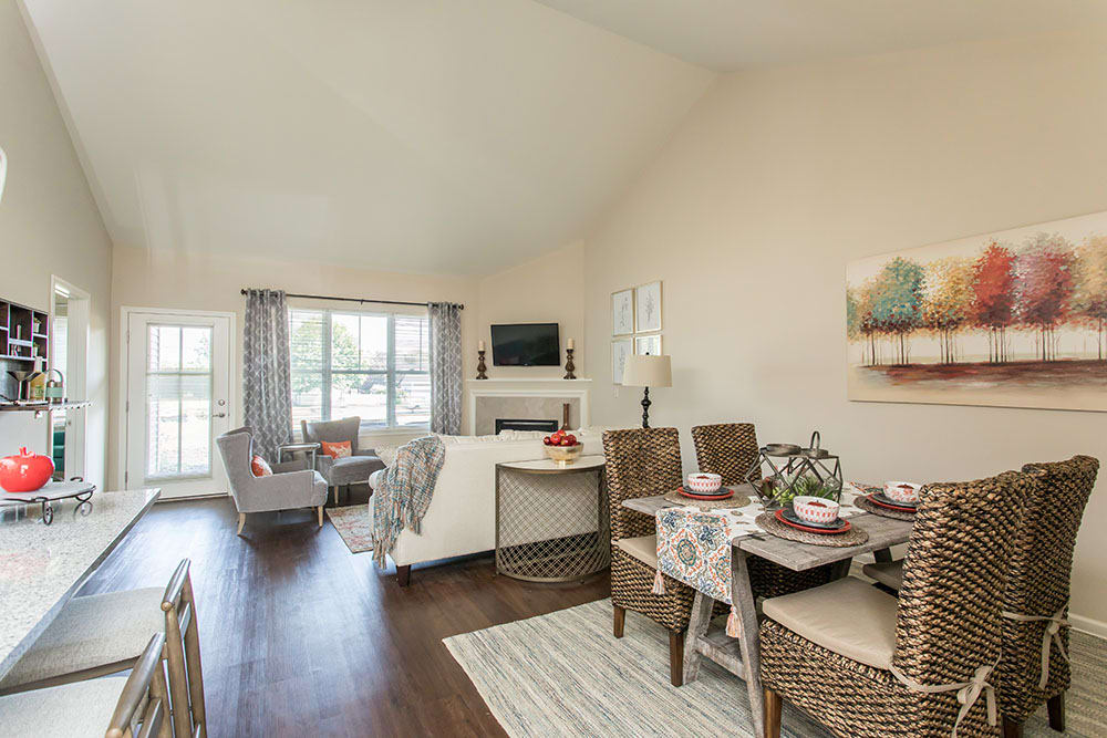 Beautiful living room and dining room at Orchard View Senior Apartments in Rochester, NY