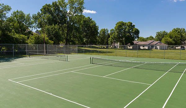 Tennis court and other amenities at apartments in Penfield, NY.