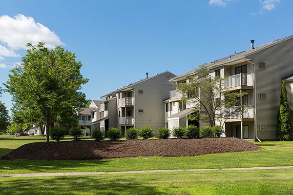 Penbrooke Meadows Apartments in Penfield community with landscaped grounds