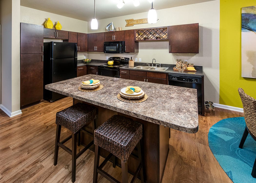 View of a kitchen at DELETED - Longitude 81 apartments